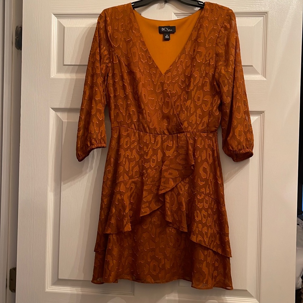 Amber colored Mini dress. New without tags. Tags removed but never worn.